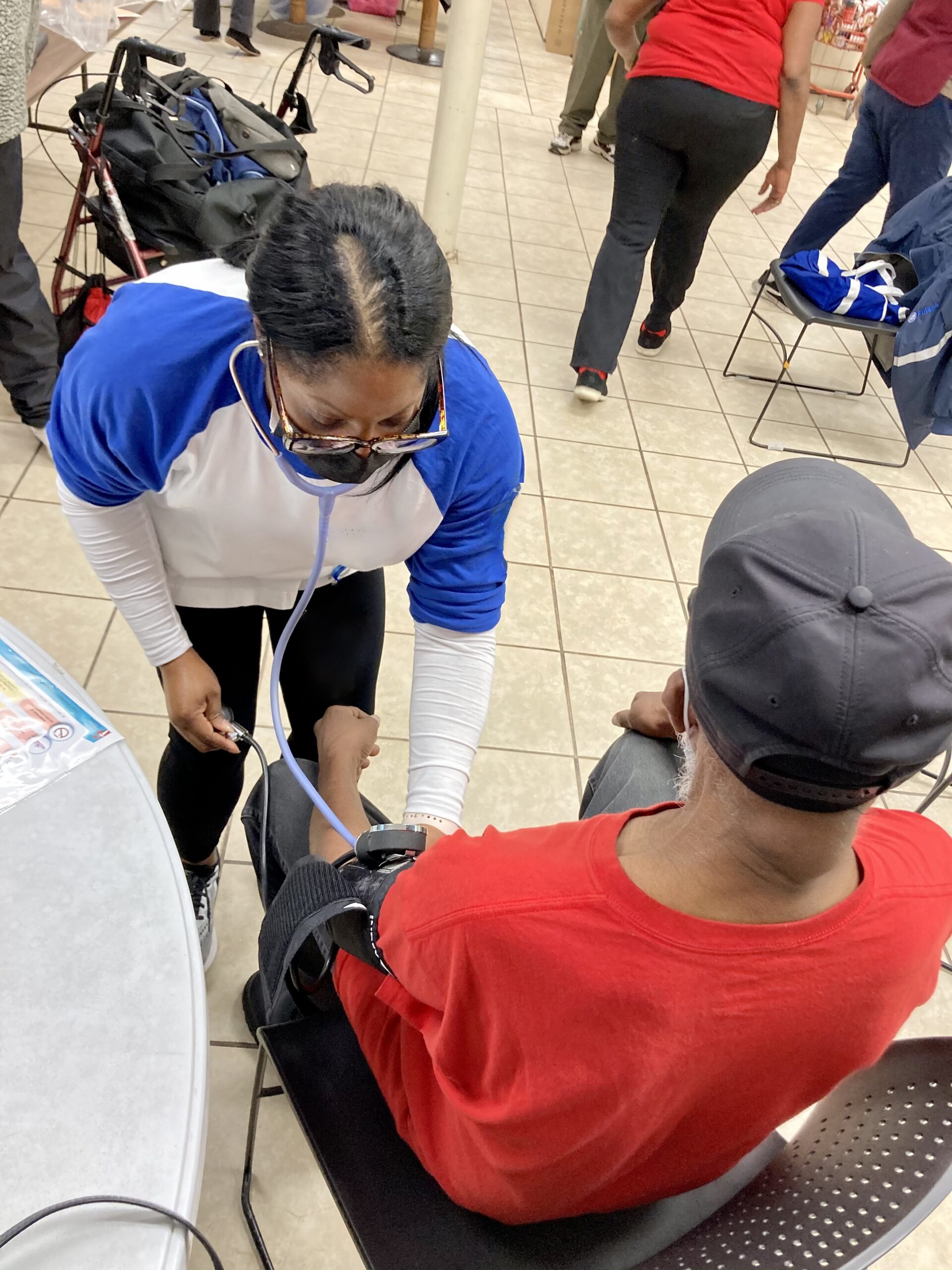 Lady giving blood pressure test